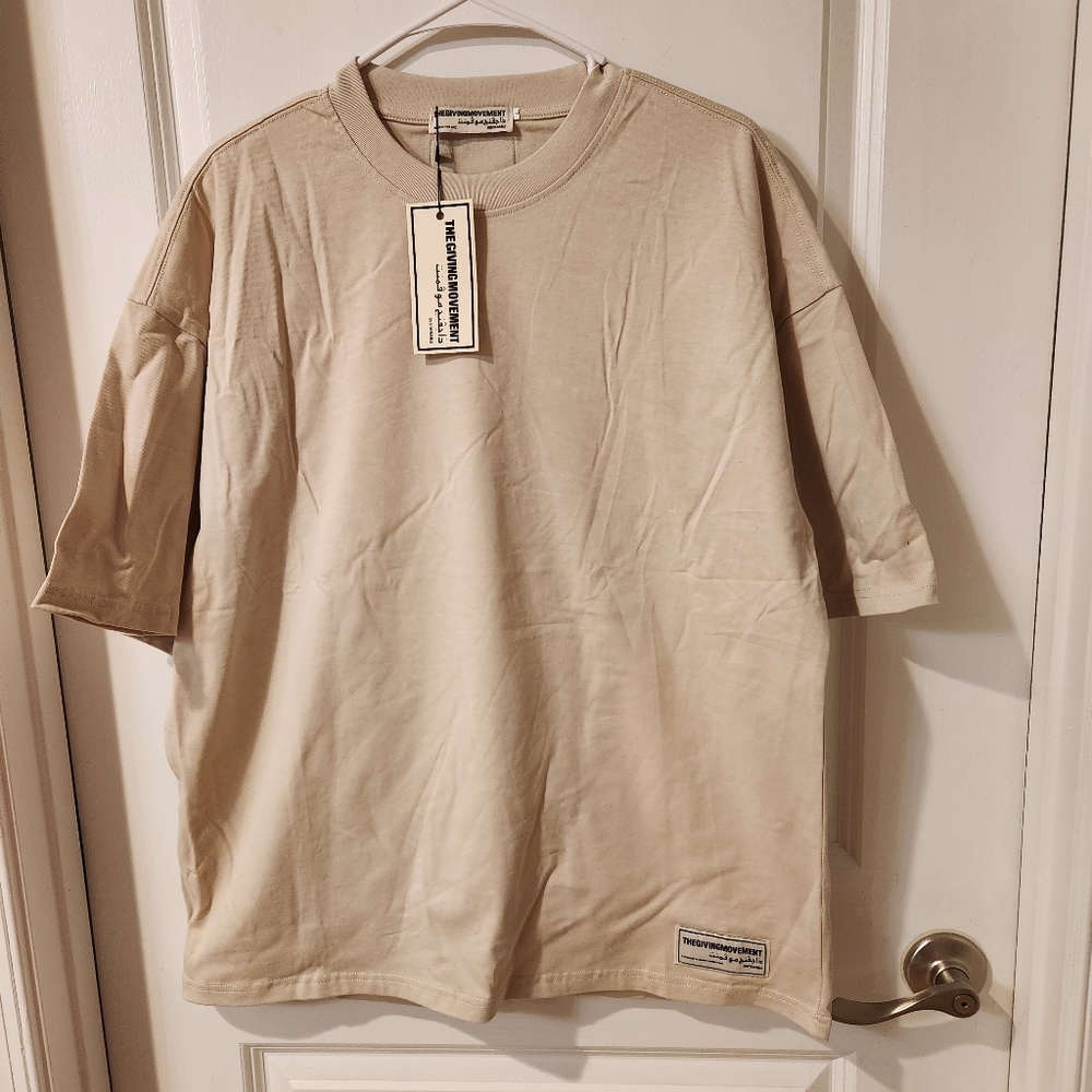 The Giving Movement unique Men luxury tshirt new with tags, made in UAE.